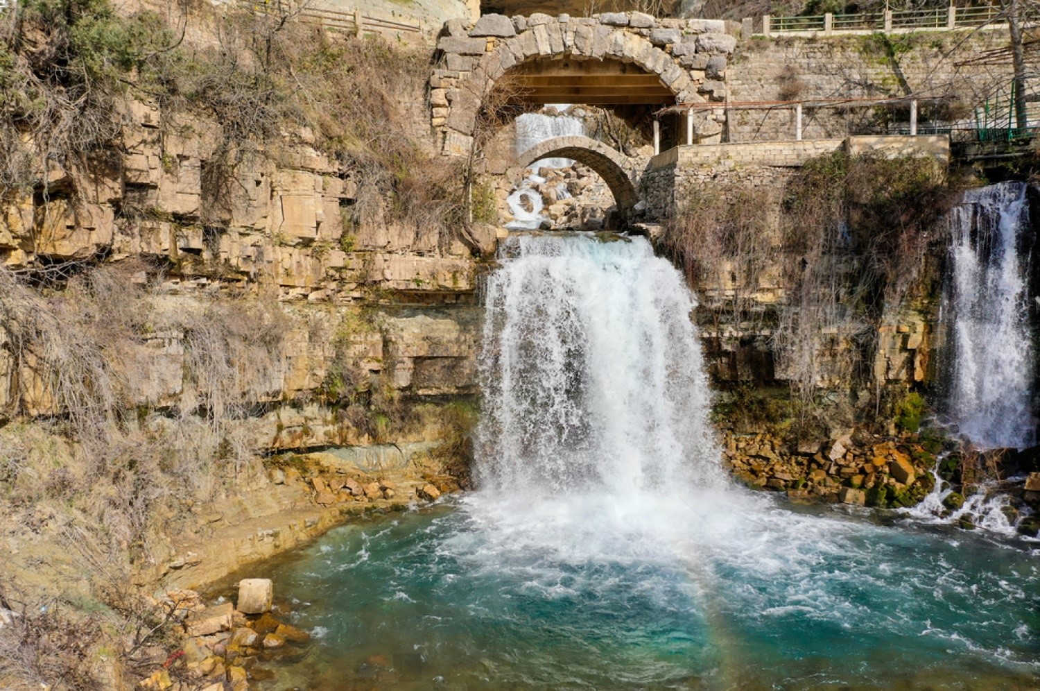 Front view of Afqa Waterfall in Lebanon cascading from the cliffs