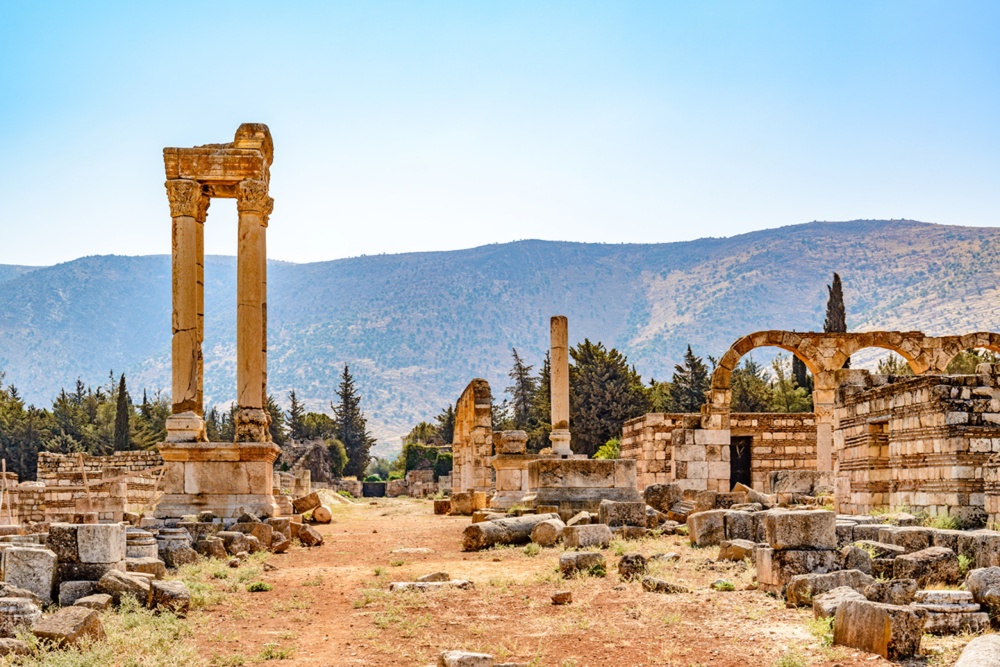 Ruins of Anjar with the iconic Tetrapylon under a clear sky